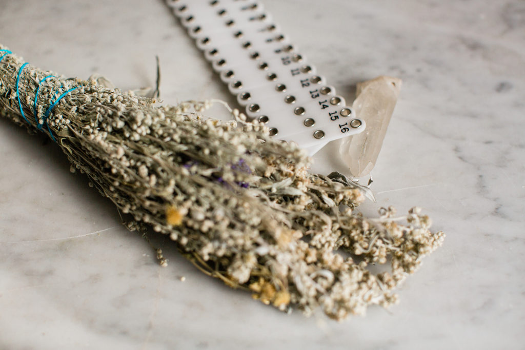 an acupoint location tool with a bundle of sage